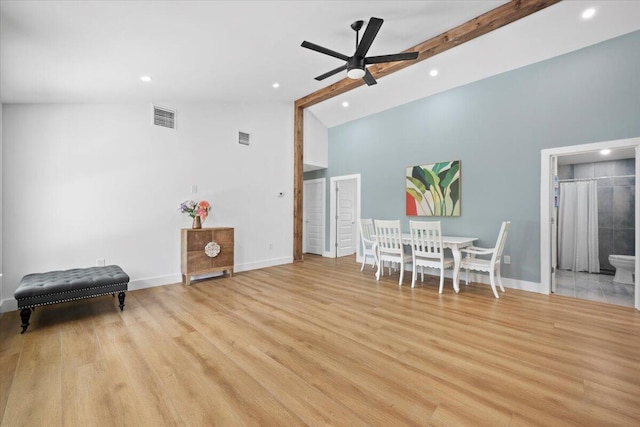 dining space featuring visible vents, baseboards, ceiling fan, and high vaulted ceiling