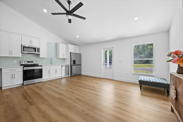 kitchen with light wood-style floors, ceiling fan, light countertops, white cabinetry, and stainless steel appliances