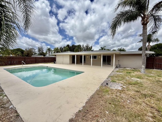 view of pool with a fenced in pool, a fenced backyard, and a patio area