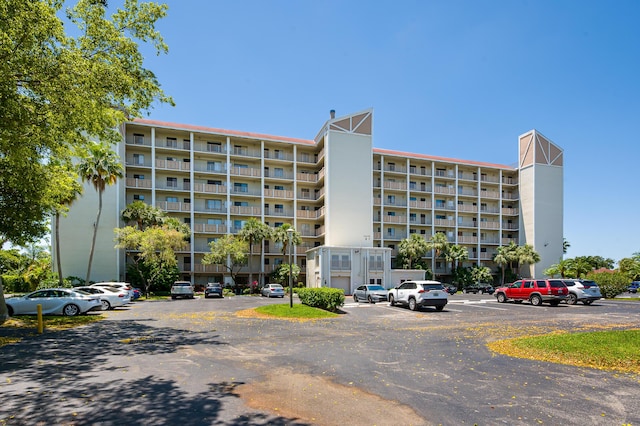 view of property with uncovered parking