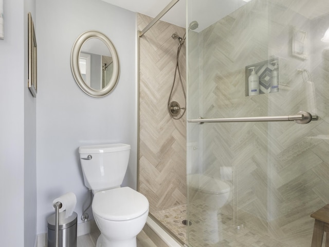 full bathroom with toilet and a shower stall