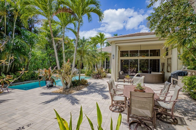 view of patio with an outdoor pool