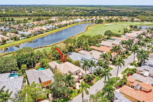 bird's eye view with a water view, golf course view, and a residential view