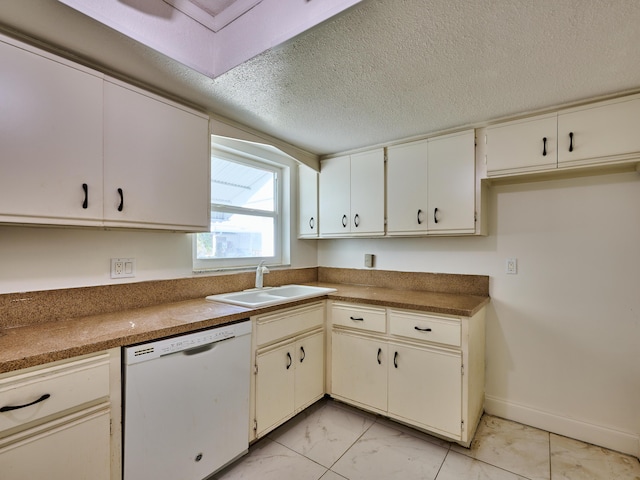 kitchen with white dishwasher, a sink, a textured ceiling, marble finish floor, and baseboards