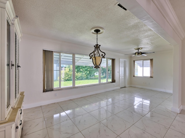 unfurnished dining area featuring crown molding, a textured ceiling, marble finish floor, ceiling fan with notable chandelier, and baseboards