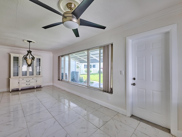 interior space with crown molding, baseboards, ceiling fan, and marble finish floor