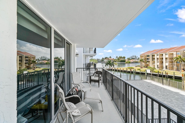 balcony featuring a water view