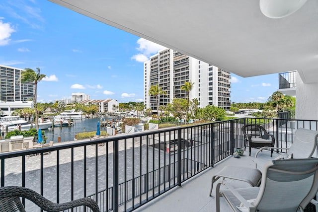 balcony featuring a water view