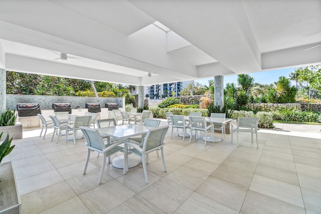 view of patio featuring ceiling fan and outdoor dining area