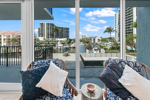 living room with a water view and a healthy amount of sunlight