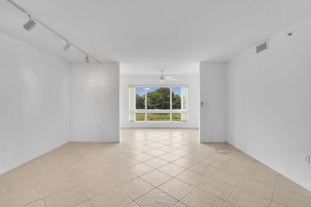 5874 Crystal Shores Dr Unit 308, Boynton Beach, FL 33437 - spare room with track lighting, light tile patterned floors, and ceiling fan