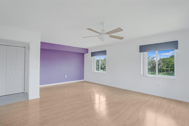 5874 Crystal Shores Dr Unit 308, Boynton Beach, FL 33437 - unfurnished room featuring wood finished floors, ceiling fan, and baseboards