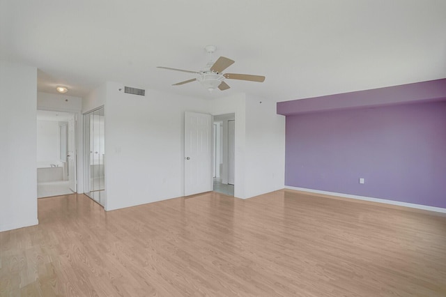 5874 Crystal Shores Dr Unit 308, Boynton Beach, FL 33437 - empty room featuring a ceiling fan and wood finished floors