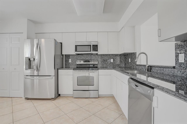 5874 Crystal Shores Dr Unit 308, Boynton Beach, FL 33437 - kitchen with appliances with stainless steel finishes, dark stone counters, a sink, and white cabinets