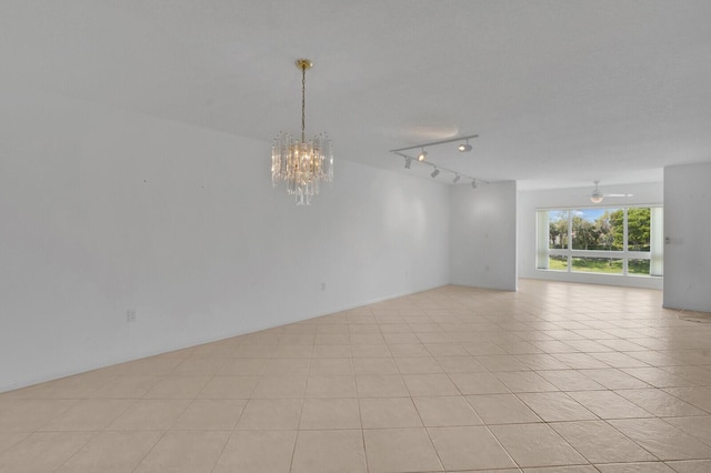 5874 Crystal Shores Dr Unit 308, Boynton Beach, FL 33437 - unfurnished room with a chandelier, ceiling fan, and rail lighting