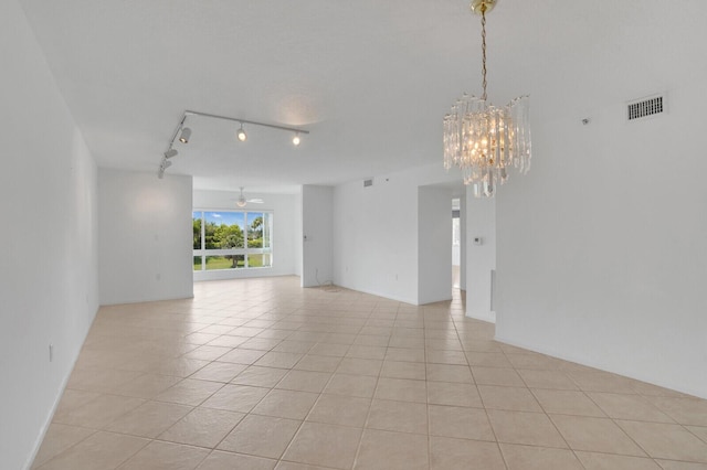 5874 Crystal Shores Dr Unit 308, Boynton Beach, FL 33437 - unfurnished room featuring track lighting, light tile patterned floors, a chandelier, and a ceiling fan