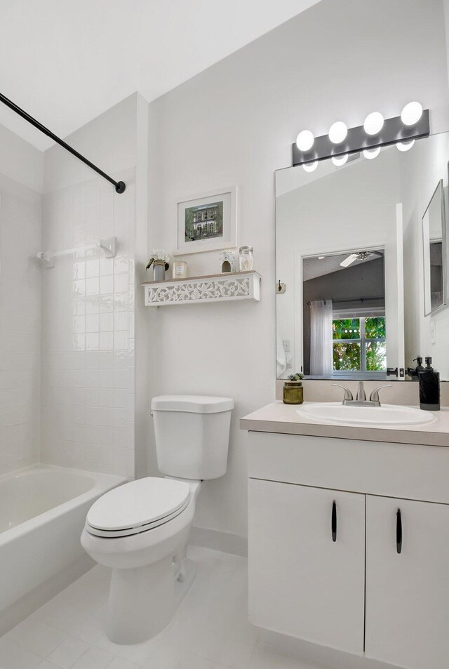 8024 Stirrup Cay Ct, Boynton Beach, FL 33436 - bathroom featuring tile patterned flooring, vanity, toilet, baseboards, and bathing tub / shower combination