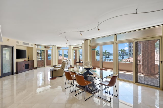 300 SE 5th Ave Unit 2050, Boca Raton, FL 33432 - dining room featuring a water view, french doors, visible vents, and plenty of natural light