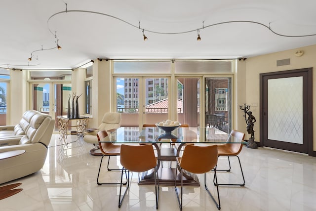 300 SE 5th Ave Unit 2050, Boca Raton, FL 33432 - dining space featuring french doors and visible vents