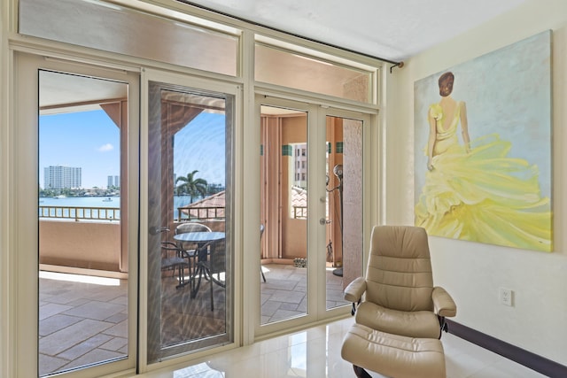 300 SE 5th Ave Unit 2050, Boca Raton, FL 33432 - entryway with a water view, a wealth of natural light, baseboards, and french doors