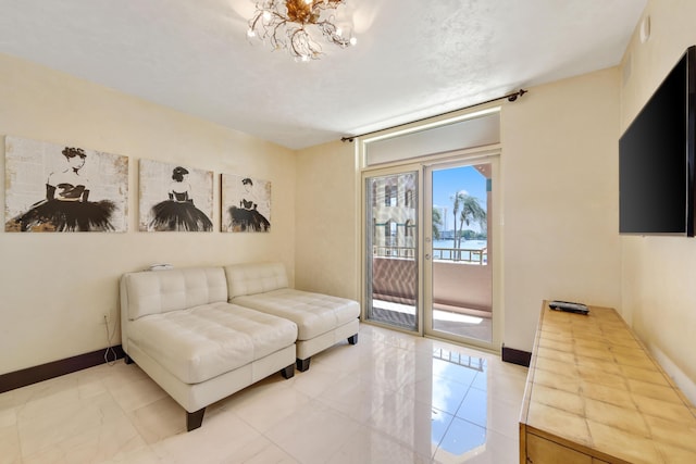 300 SE 5th Ave Unit 2050, Boca Raton, FL 33432 - living room with a chandelier and baseboards