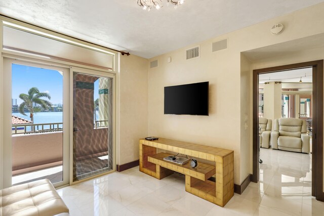 300 SE 5th Ave Unit 2050, Boca Raton, FL 33432 - living area featuring a water view, marble finish floor, baseboards, and visible vents