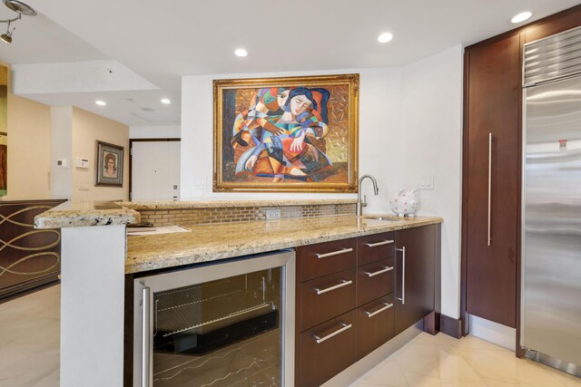 300 SE 5th Ave Unit 2050, Boca Raton, FL 33432 - bar featuring wine cooler, recessed lighting, a sink, backsplash, and built in refrigerator