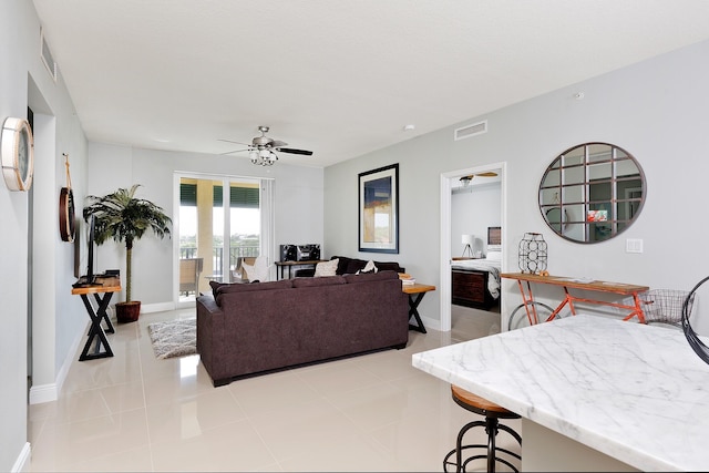 255 NE 3rd Ave Unit 2501, Delray Beach, FL 33444 - living room with light tile patterned floors, visible vents, ceiling fan, and baseboards