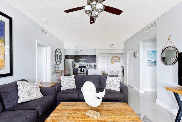 255 NE 3rd Ave Unit 2501, Delray Beach, FL 33444 - living area with tile patterned floors, visible vents, and ceiling fan