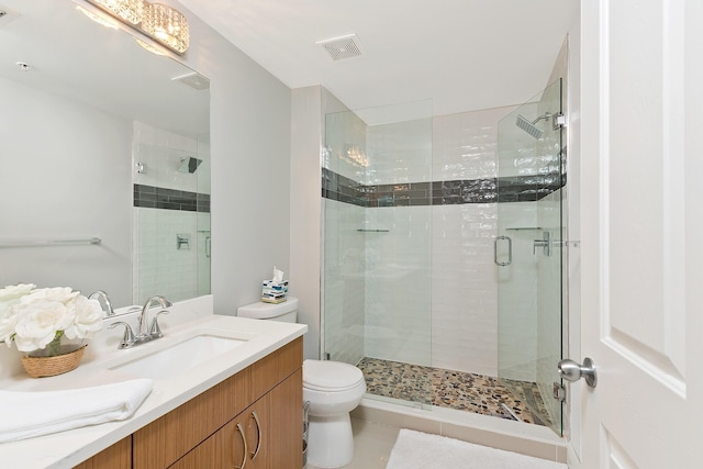 255 NE 3rd Ave Unit 2501, Delray Beach, FL 33444 - bathroom featuring visible vents, a stall shower, toilet, vanity, and tile patterned flooring