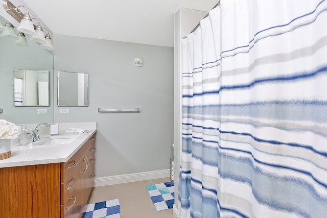 255 NE 3rd Ave Unit 2501, Delray Beach, FL 33444 - bathroom with tile patterned floors, vanity, and baseboards