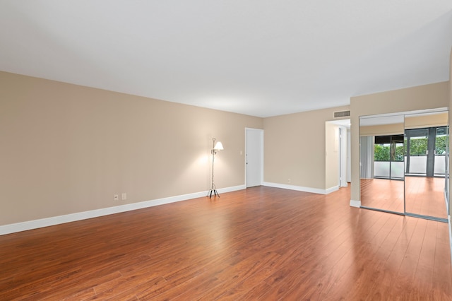 6534 Spring Bottom Way Unit 123, Boca Raton, FL 33433 - empty room featuring baseboards, visible vents, and wood finished floors