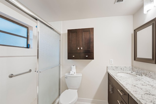 6534 Spring Bottom Way Unit 123, Boca Raton, FL 33433 - bathroom with visible vents, a stall shower, vanity, baseboards, and toilet