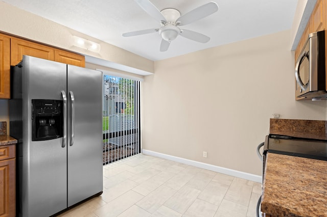 6534 Spring Bottom Way Unit 123, Boca Raton, FL 33433 - kitchen with baseboards, ceiling fan, brown cabinets, and stainless steel appliances