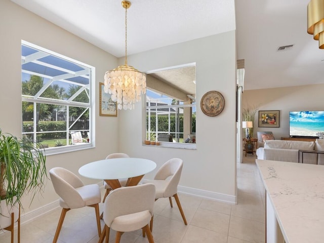 6000 Venetto Way, Vero Beach, FL 32967 - dining area featuring baseboards, visible vents, and a wealth of natural light