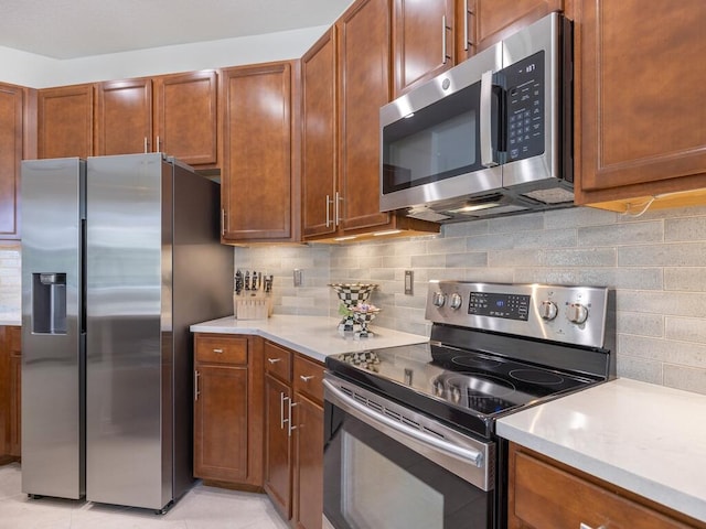 6000 Venetto Way, Vero Beach, FL 32967 - kitchen with appliances with stainless steel finishes, decorative backsplash, and light countertops