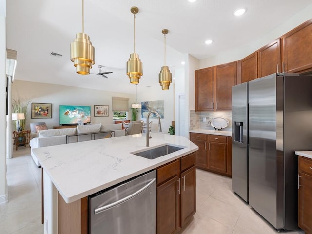 6000 Venetto Way, Vero Beach, FL 32967 - kitchen featuring light tile patterned flooring, open floor plan, appliances with stainless steel finishes, and a sink
