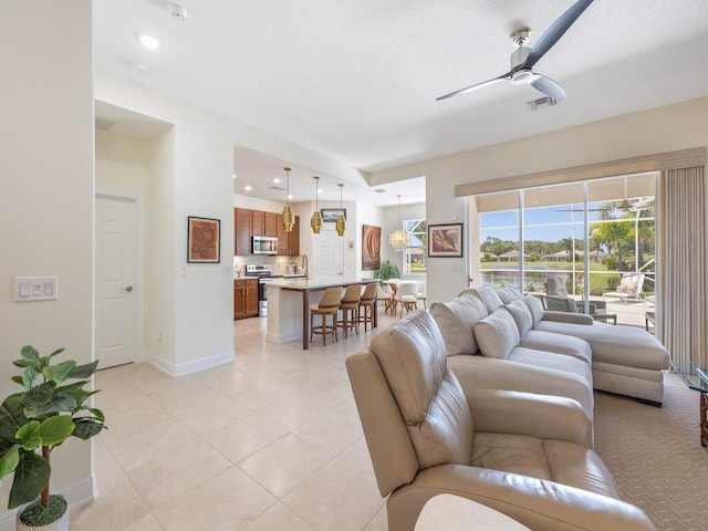6000 Venetto Way, Vero Beach, FL 32967 - living area with recessed lighting, light tile patterned flooring, ceiling fan, visible vents, and baseboards