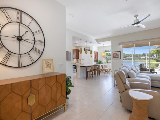 6000 Venetto Way, Vero Beach, FL 32967 - living room with light tile patterned floors and ceiling fan