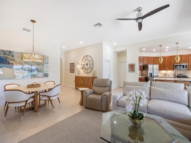 6000 Venetto Way, Vero Beach, FL 32967 - living area featuring light tile patterned flooring, visible vents, ceiling fan, and recessed lighting