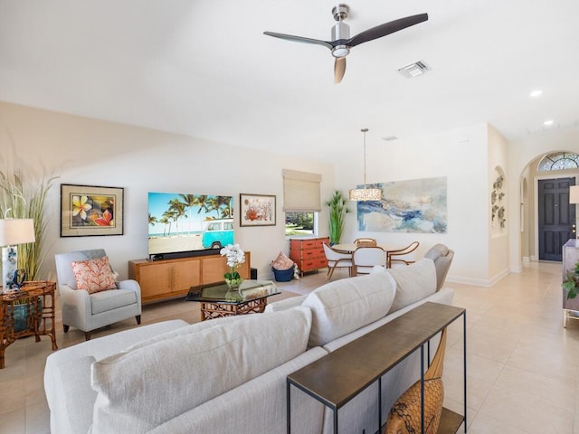 6000 Venetto Way, Vero Beach, FL 32967 - living room featuring visible vents, arched walkways, a wealth of natural light, and light tile patterned floors