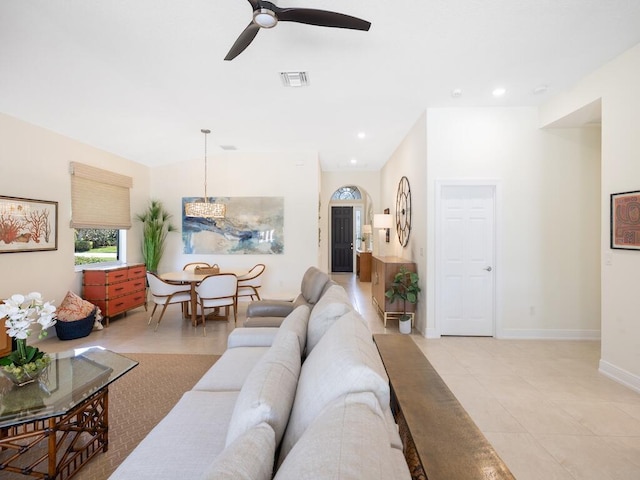 6000 Venetto Way, Vero Beach, FL 32967 - living area with recessed lighting, light tile patterned flooring, visible vents, baseboards, and ceiling fan with notable chandelier