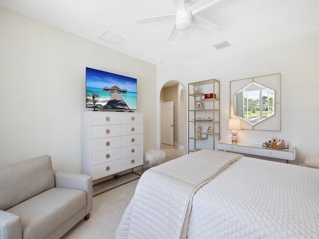 6000 Venetto Way, Vero Beach, FL 32967 - bedroom featuring light tile patterned floors, visible vents, ceiling fan, and arched walkways