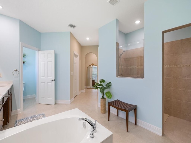 6000 Venetto Way, Vero Beach, FL 32967 - bathroom with walk in shower, a garden tub, vanity, and visible vents