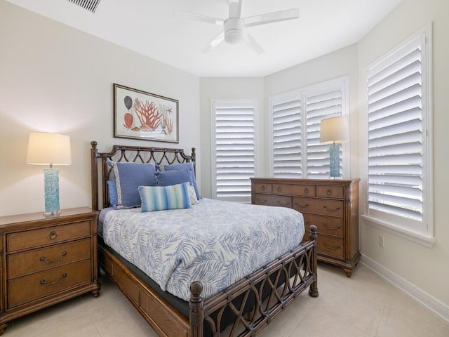 6000 Venetto Way, Vero Beach, FL 32967 - bedroom with light tile patterned floors, a ceiling fan, and baseboards