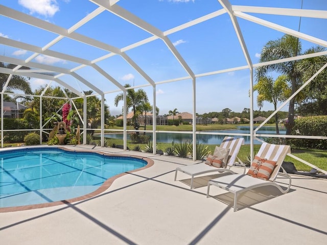 6000 Venetto Way, Vero Beach, FL 32967 - outdoor pool with glass enclosure, a water view, and a patio area