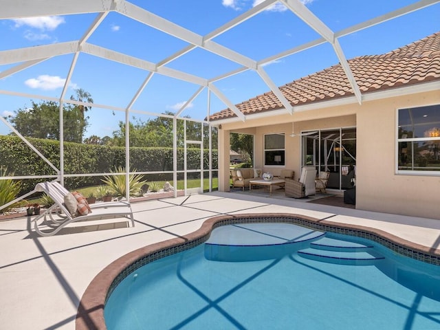 6000 Venetto Way, Vero Beach, FL 32967 - outdoor pool featuring a patio area, outdoor lounge area, and glass enclosure