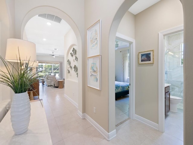 6000 Venetto Way, Vero Beach, FL 32967 - hallway with baseboards, visible vents, light tile patterned flooring, and recessed lighting
