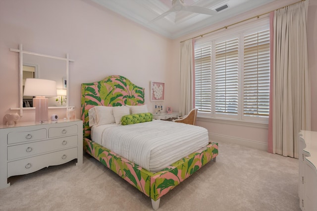 bedroom featuring visible vents, carpet flooring, crown molding, and ceiling fan