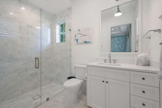 bathroom featuring vanity, a shower stall, toilet, and marble finish floor